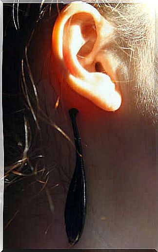 Woman has leeches behind her ear