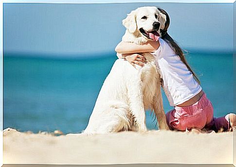 A girl is happy with her dog